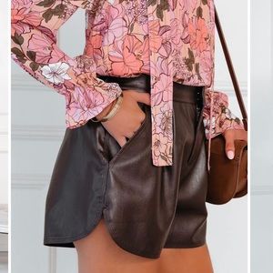 Vici Mari high rise pocketed faux leather shorts